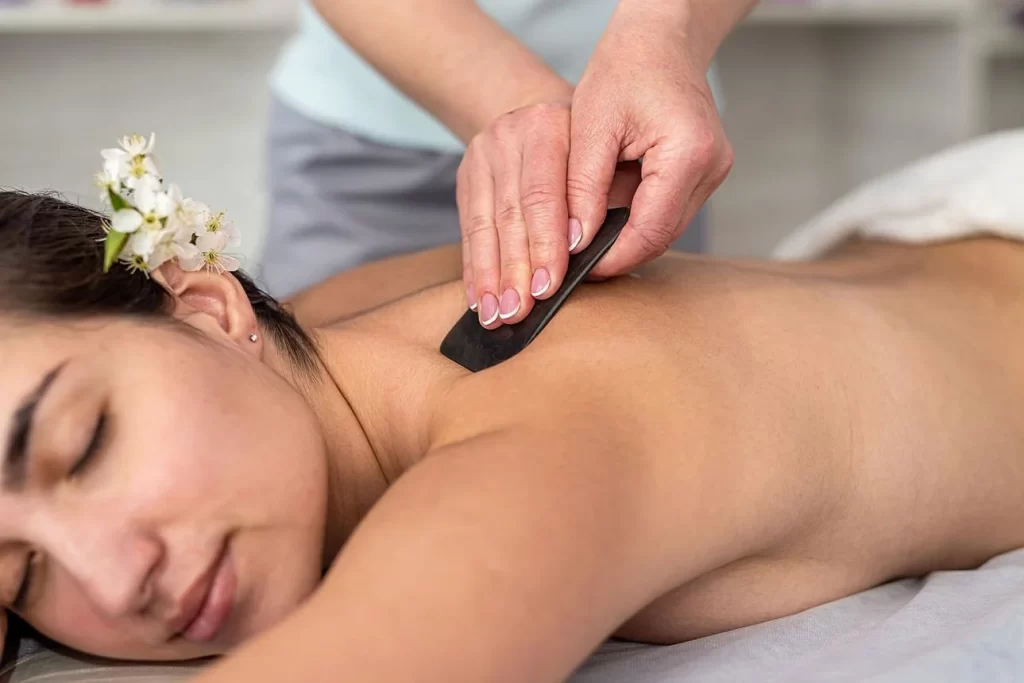 Professional Gua Sha therapy for muscle recovery